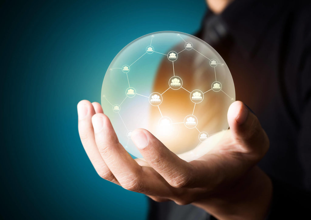 a hand holding a crystal ball of connected data